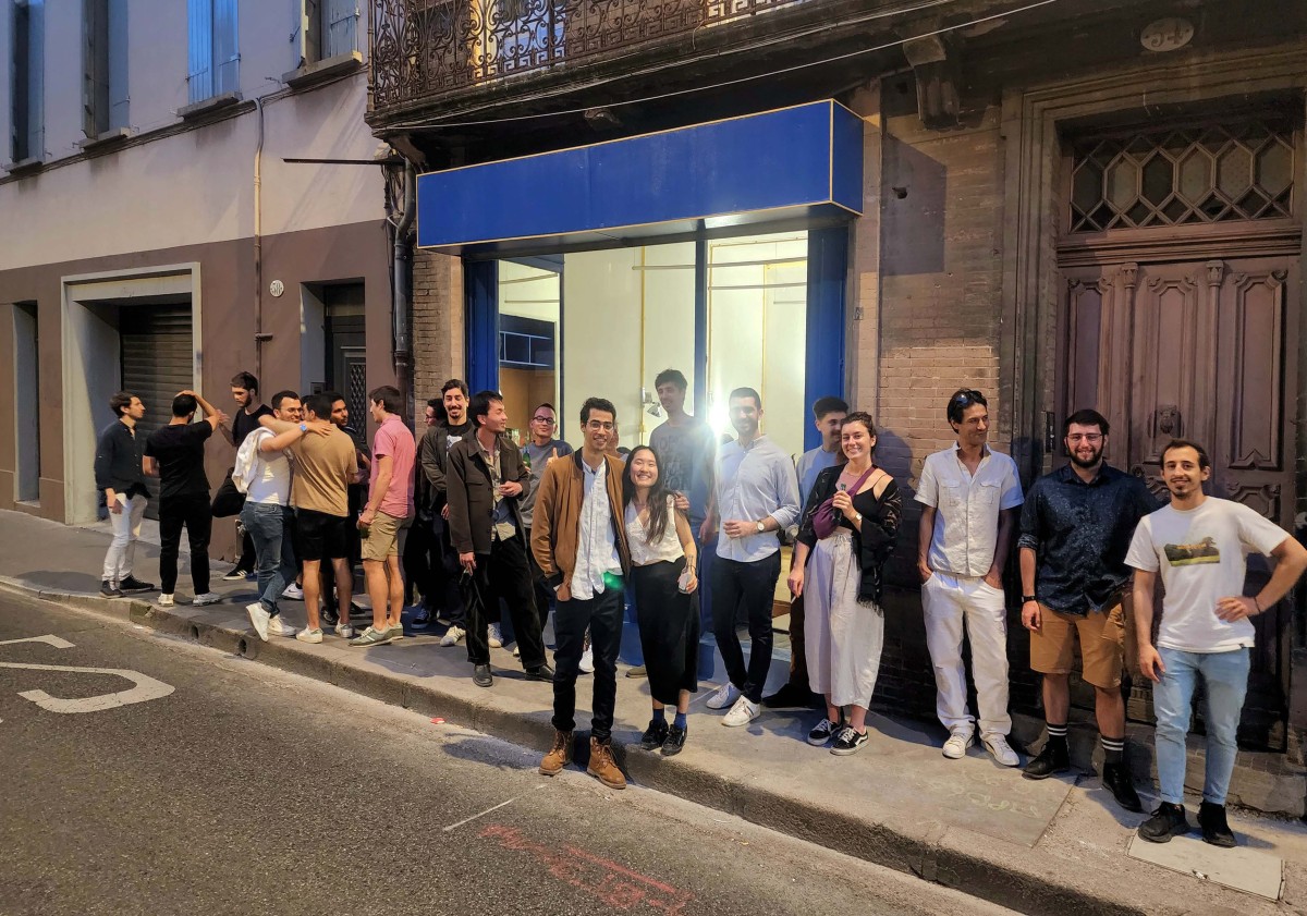 The team and friends celebrating outside the new office